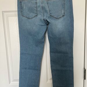 Womens light blue lightly distressed jeans. Size 6 short